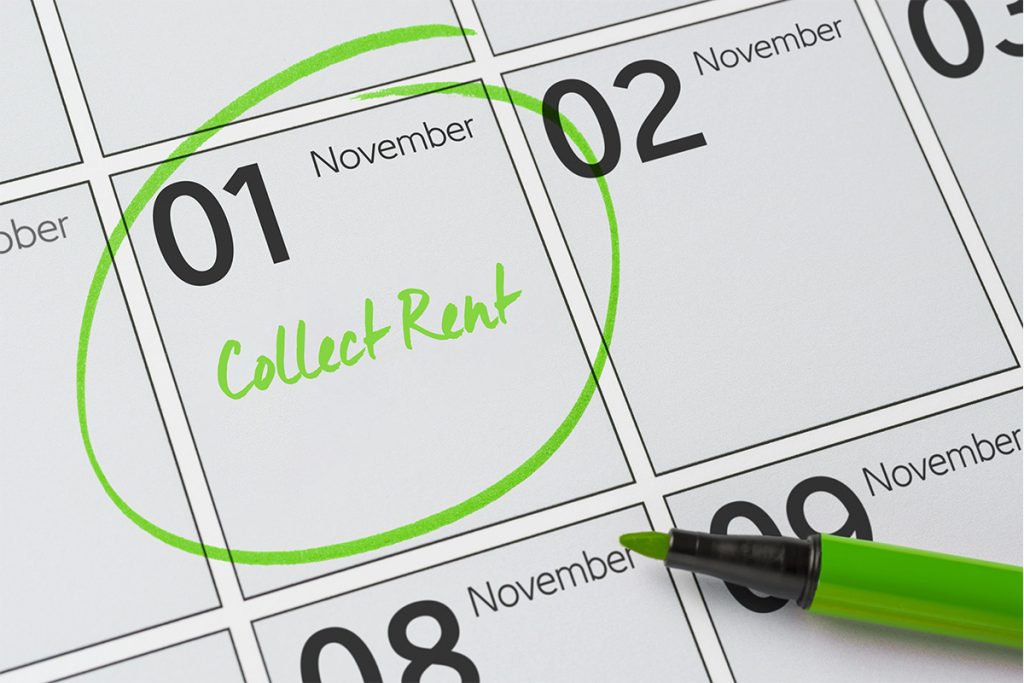 Calendar marked with “Collect Rent” on November 1, representing the challenges Dallas landlords face with rental properties and the option to sell fast for cash