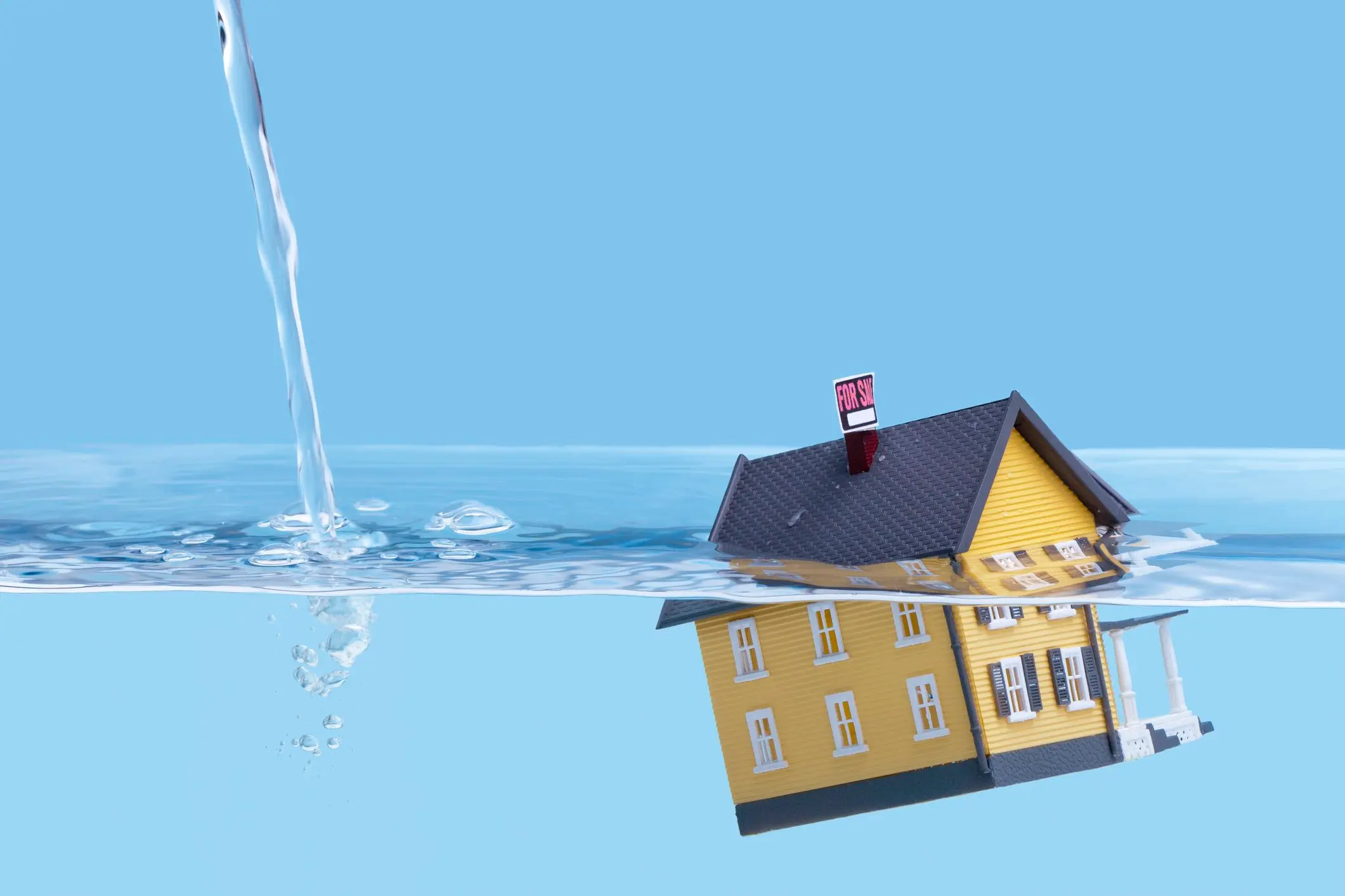 Underwater mortgage concept showing a house sinking in water with a for sale sign, symbolizing financial distress and the urgency to sell in Dallas