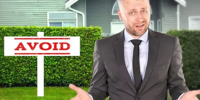 Confused man standing in front of a house with an “Avoid” sign, symbolizing the pitfalls homeowners can bypass by selling directly to Best Texas House Buyers in Dallas