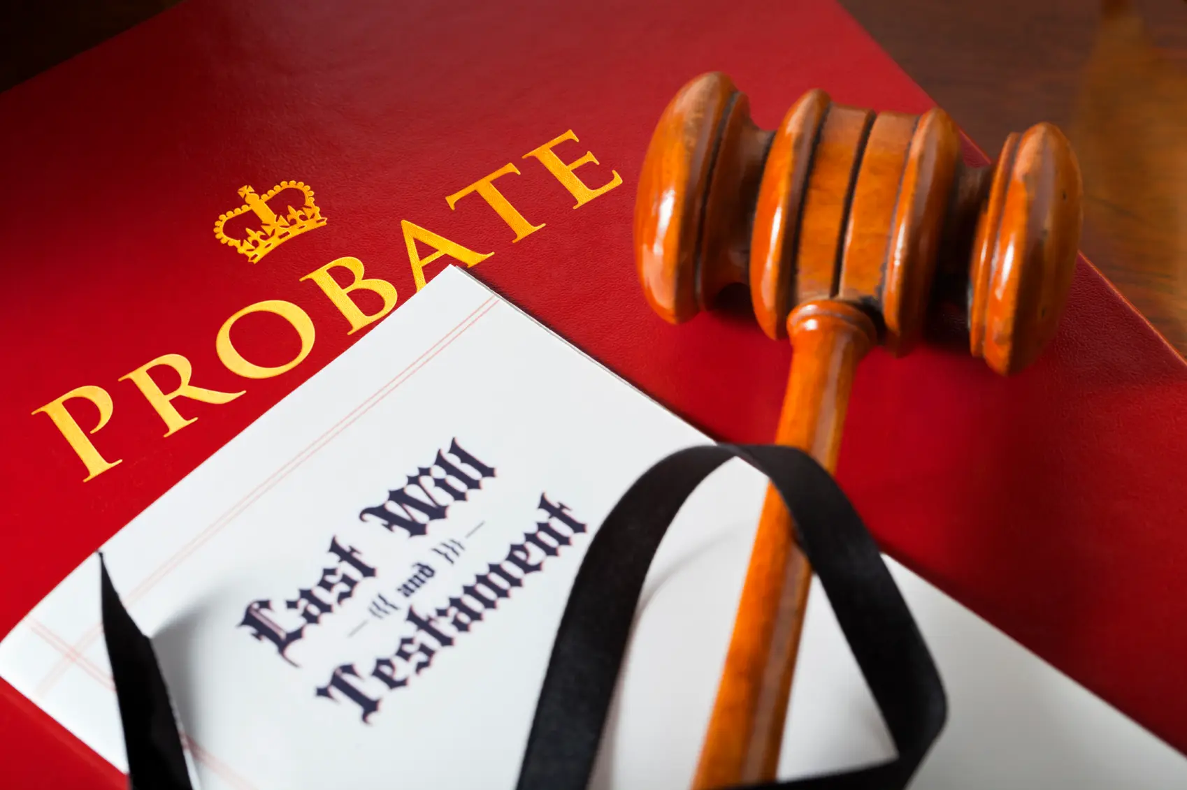 Gavel resting on a last will and testament in probate court, representing how Best Texas House Buyers helps Dallas homeowners sell inherited properties for cash